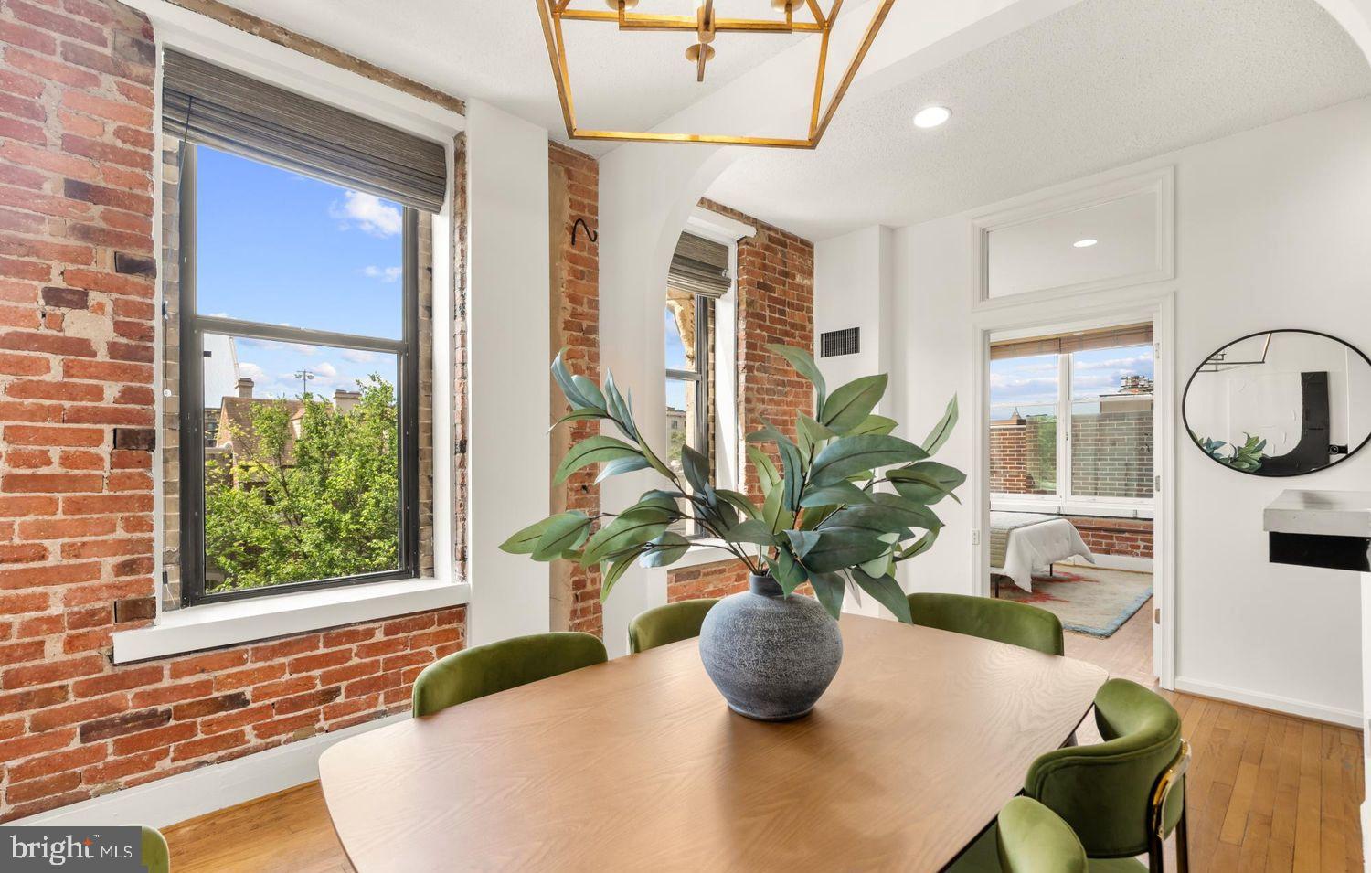 1615 Q Street Northwest, Unit 301/303 Washington, DC 20009 - Photo 7 of 53 a view of a living room with a potted plant