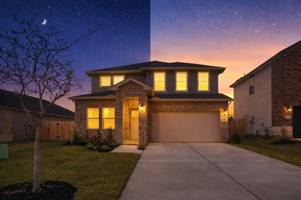 a front view of a house with a yard