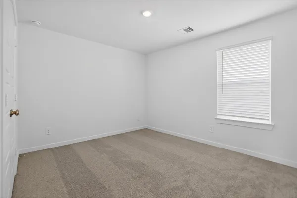 a living room with furniture a table and a large window