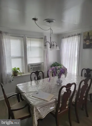 a view of a dining room with furniture and window