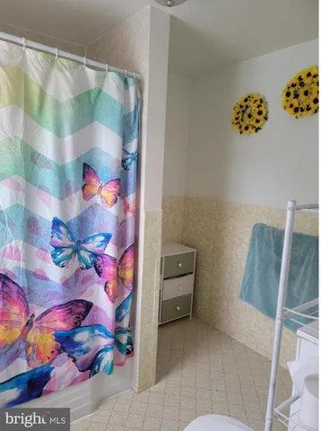 a bathroom with a sink toilet and bathtub