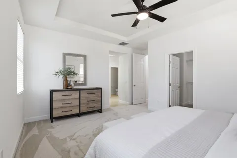 a bedroom with a bed and a dresser