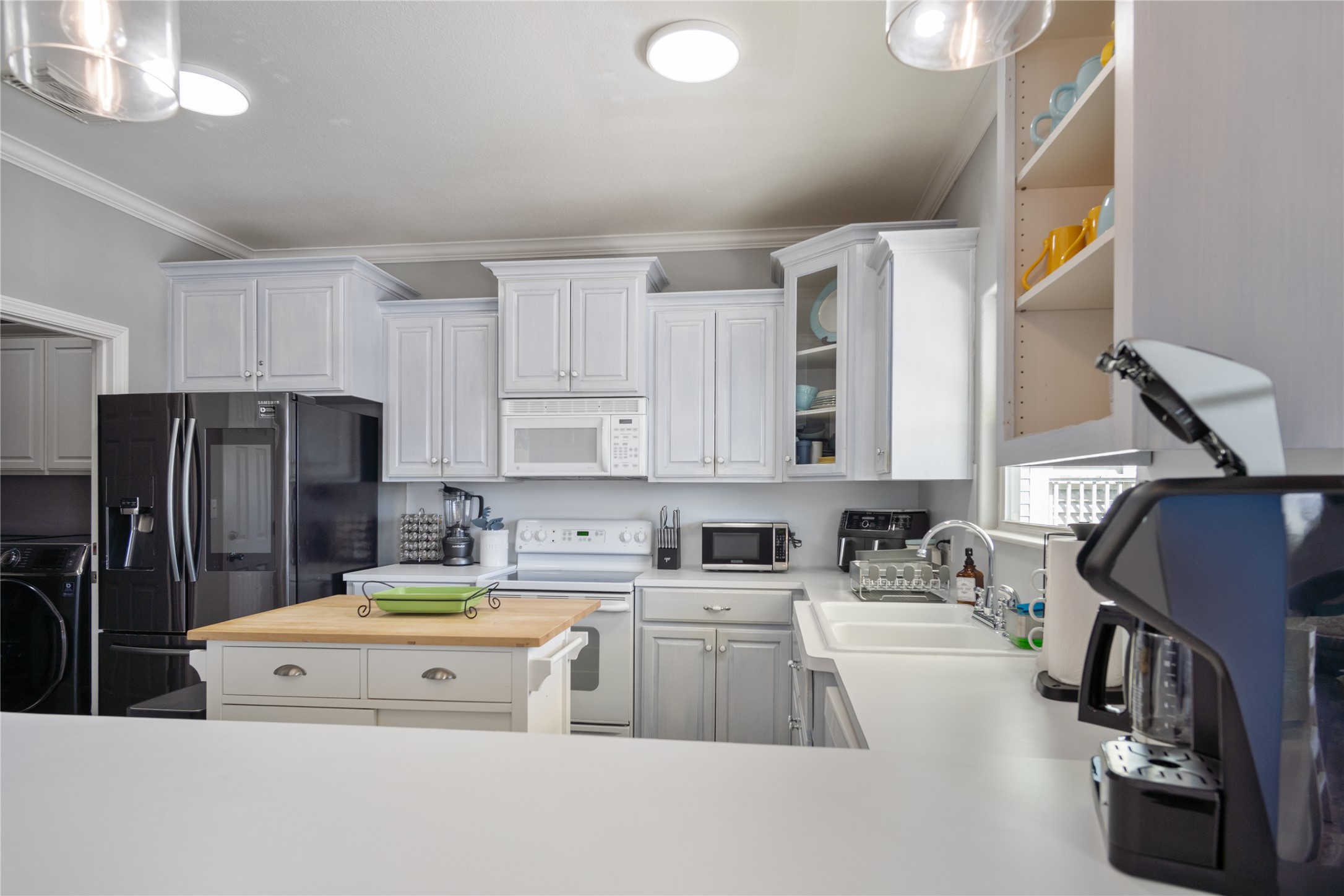 2296 Martinique Crystal Beach, TX 77650 - Photo 14 of 49 a kitchen that has a sink cabinets counter space and stainless steel appliances