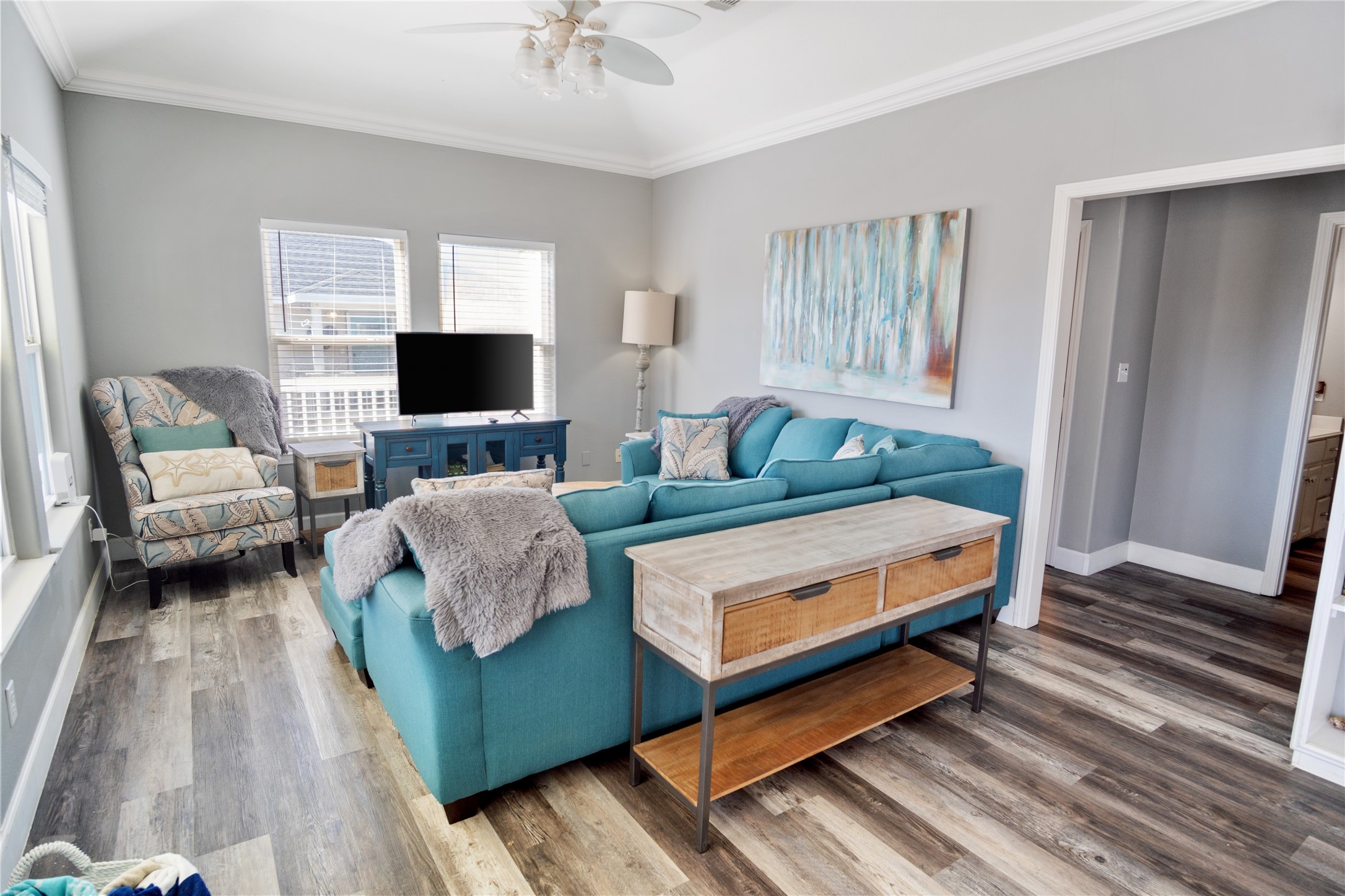 2296 Martinique Crystal Beach, TX 77650 - Photo 17 of 49 a bedroom with furniture and a flat screen tv