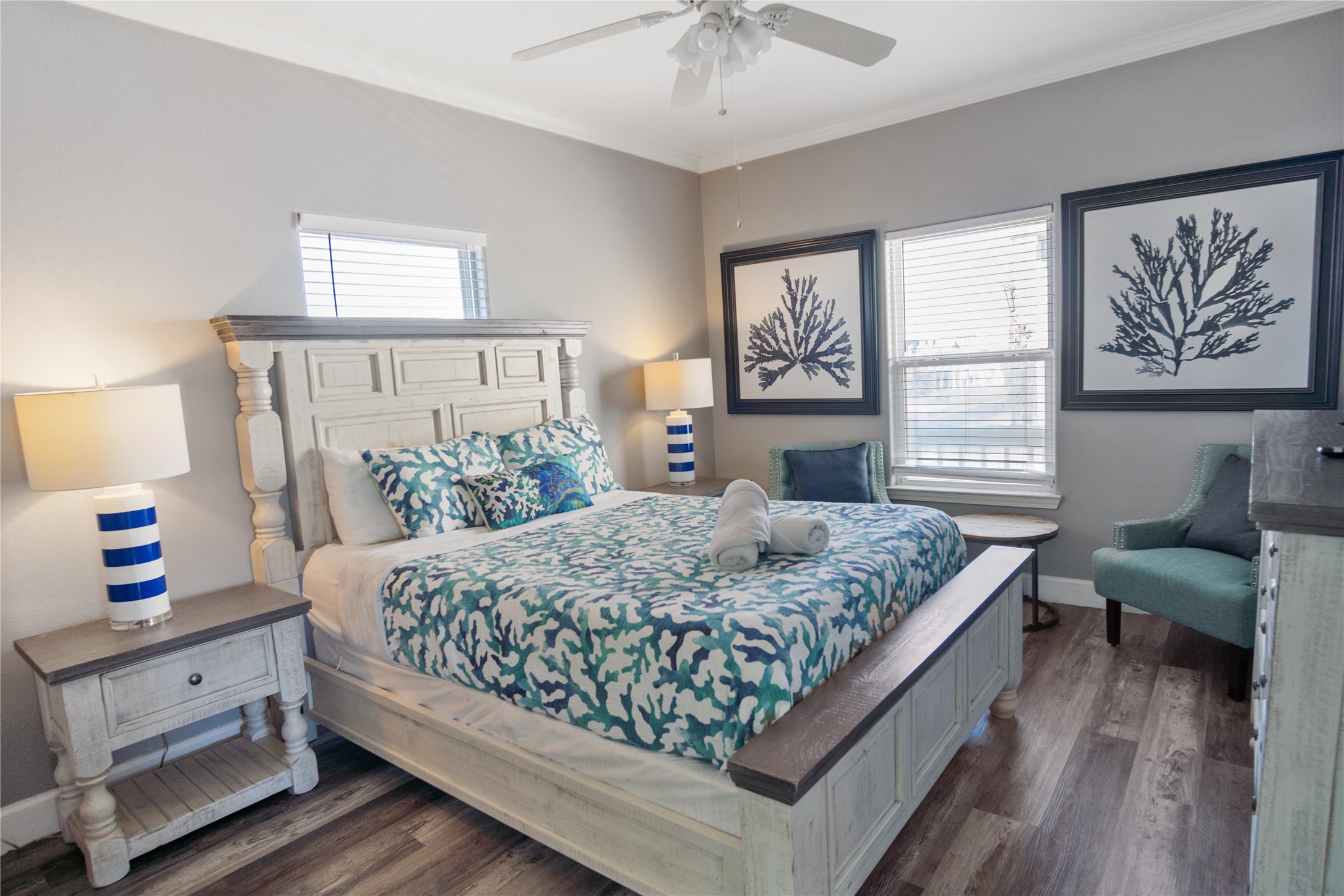 2296 Martinique Crystal Beach, TX 77650 - Photo 20 of 49 a bedroom with a large bed and a couch