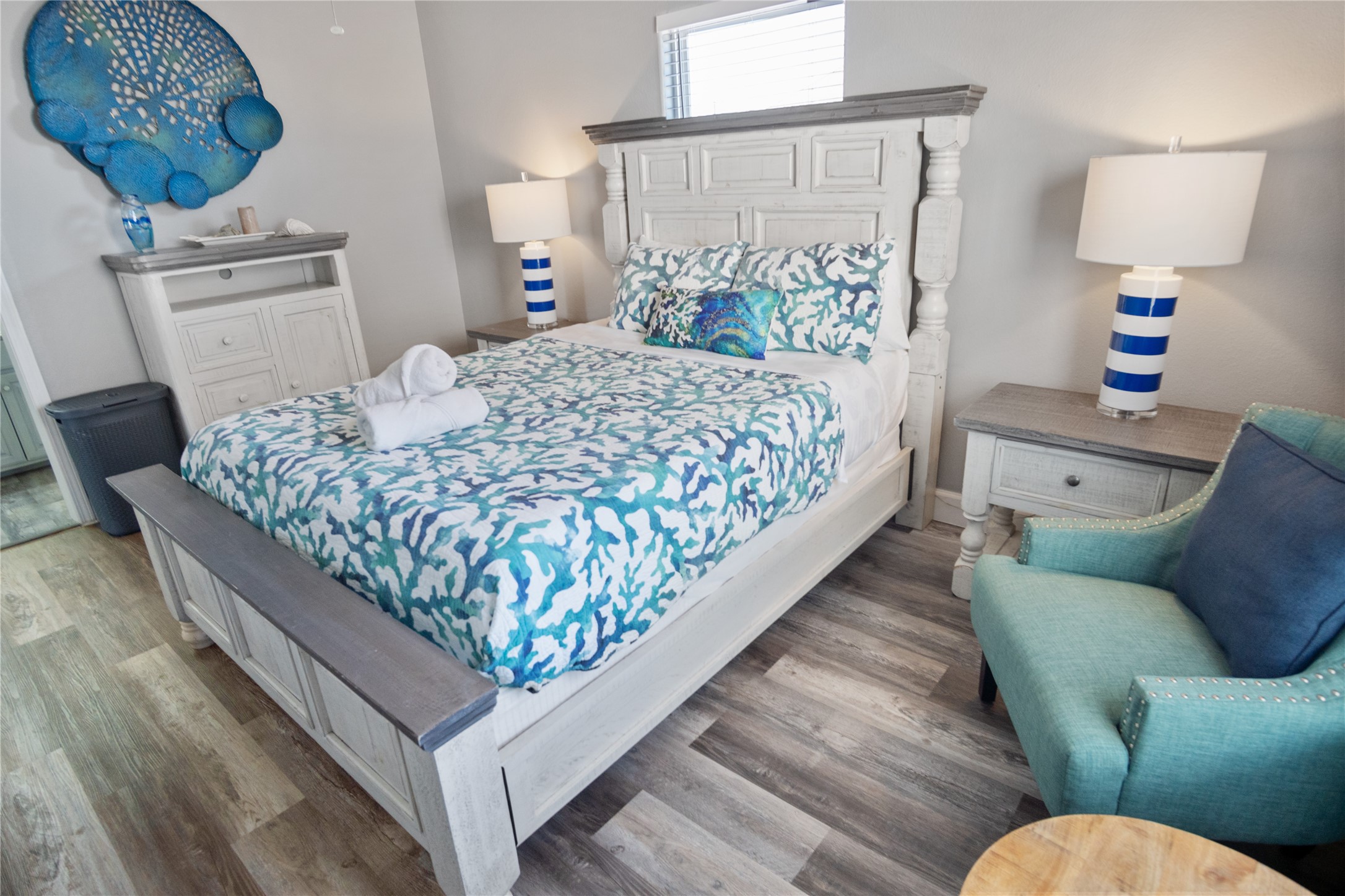 2296 Martinique Crystal Beach, TX 77650 - Photo 21 of 49 a bedroom with a bed couch and a window