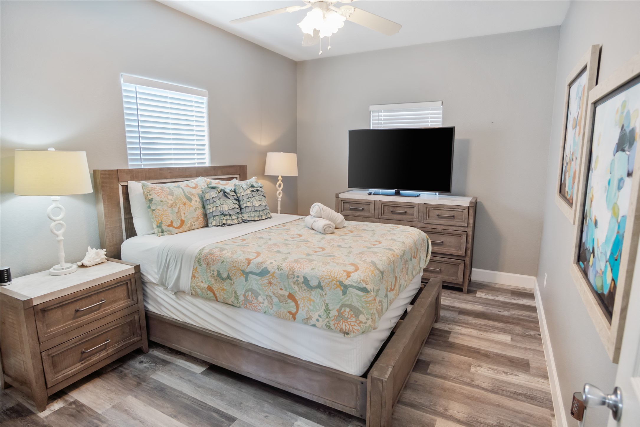 2296 Martinique Crystal Beach, TX 77650 - Photo 28 of 49 a bedroom with a bed and a flat screen tv