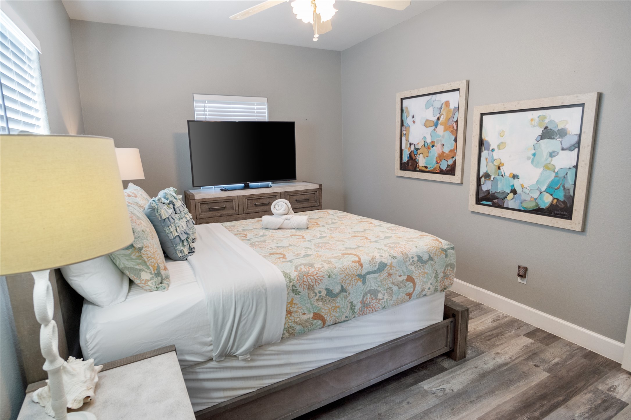 2296 Martinique Crystal Beach, TX 77650 - Photo 29 of 49 a bedroom with a bed and a flat screen tv