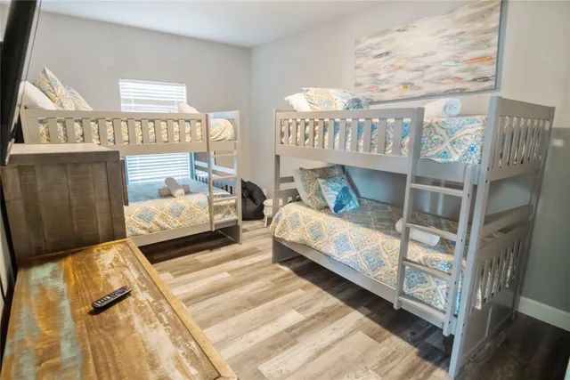 a bedroom with bed and a window