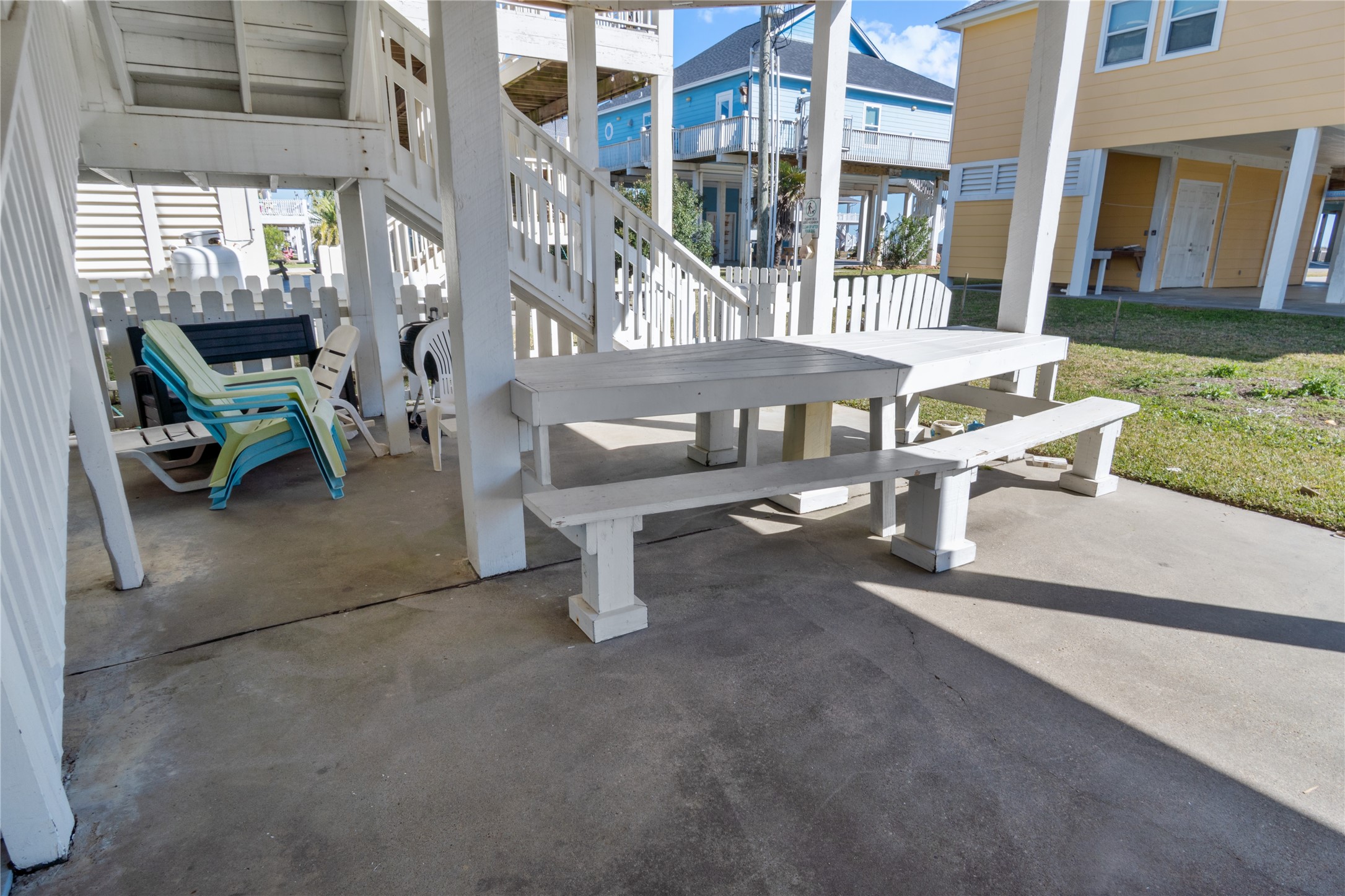 2296 Martinique Crystal Beach, TX 77650 - Photo 39 of 49 a view of a patio with table and chairs and potted plants