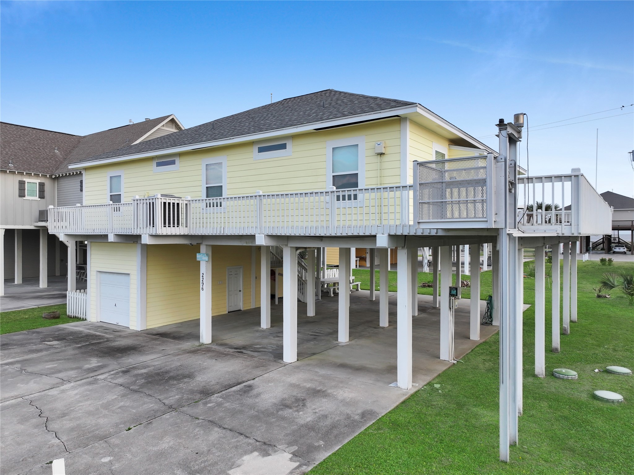 2296 Martinique Crystal Beach, TX 77650 - Photo 45 of 49 a view of a house with wooden floor and a yard
