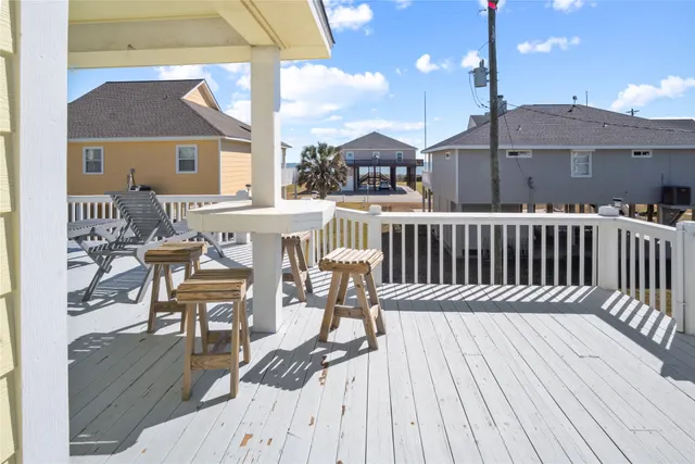 a view of a patio with a table and chairs