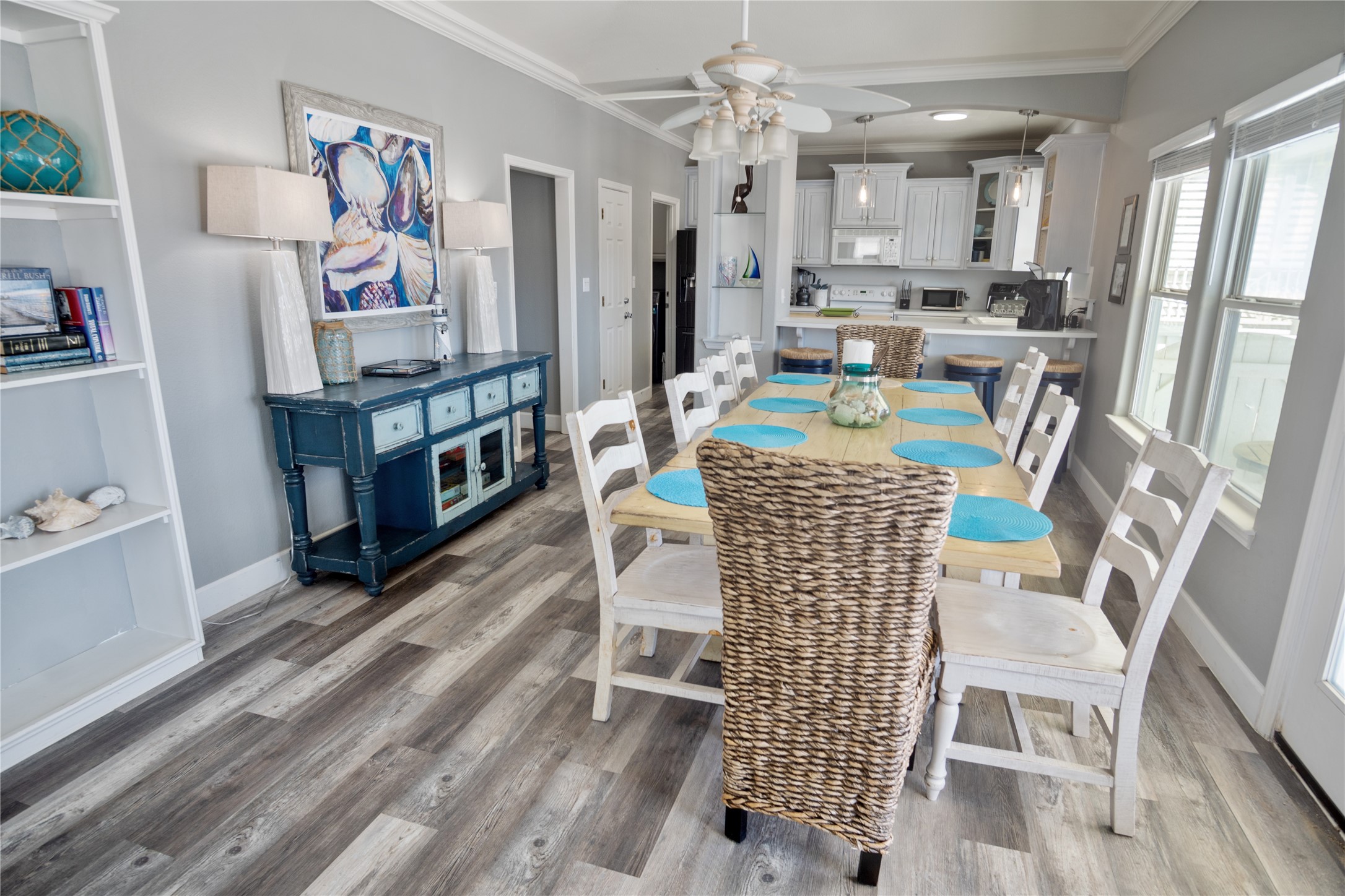 2296 Martinique Crystal Beach, TX 77650 - Photo 10 of 49 a living room with stainless steel appliances furniture a rug and a kitchen view