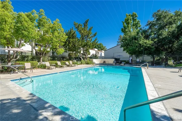 a view of yard with swimming pool