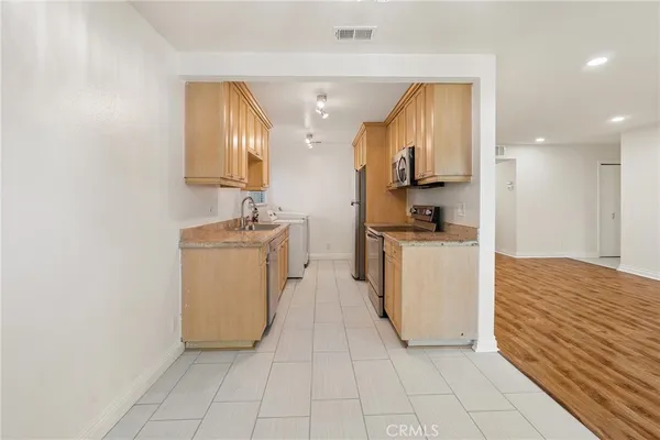 a view of a kitchen with a sink