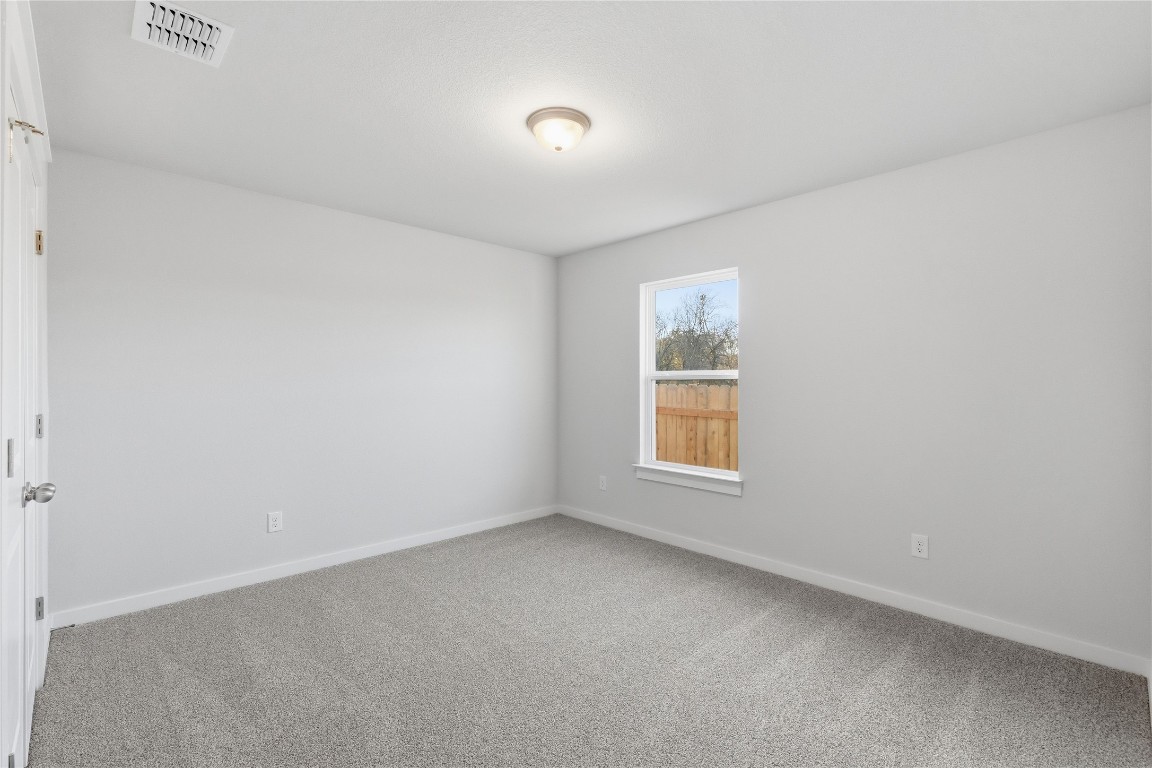 350 Mustang Bend Kyle, TX 78640 - Photo 12 of 18 Carpeted empty room with baseboards