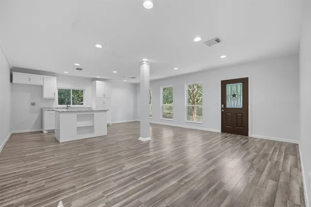 a view of kitchen with cabinets and wooden floor