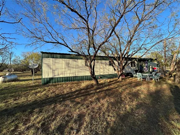 a view of backyard with green space