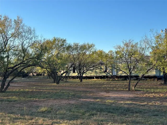 a view of road with trees