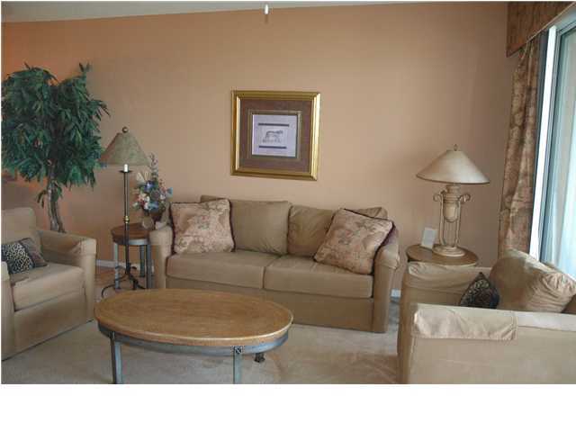 10254 East Hwy Inlet Beach, Unit 13W 30A Inlet Beach, FL 32461 - Photo 1 of 16 a living room with furniture and a potted plant