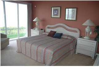 10254 East Hwy Inlet Beach, Unit 13W 30A Inlet Beach, FL 32461 - Photo 4 of 16 a bedroom with a bed window and a lamp