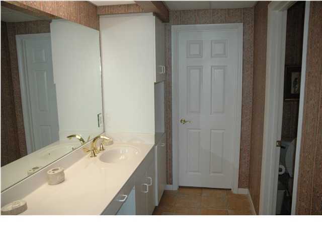 10254 East Hwy Inlet Beach, Unit 13W 30A Inlet Beach, FL 32461 - Photo 5 of 16 a bathroom with a sink a shower and a mirror