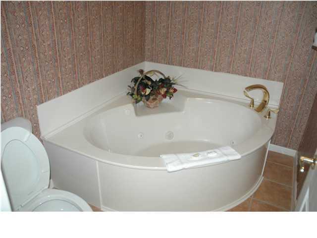 10254 East Hwy Inlet Beach, Unit 13W 30A Inlet Beach, FL 32461 - Photo 6 of 16 a white bath tub sitting in a bathroom