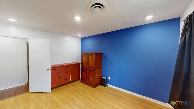 a view of an empty room and window