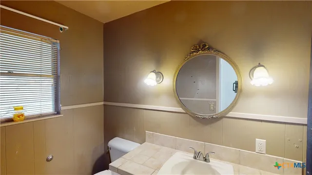 a view of a house with backyard porch and sitting area