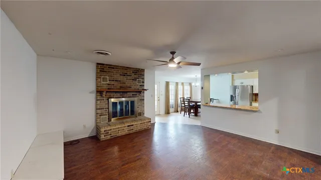 a dining room with furniture and wooden floor