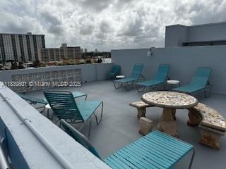 320 South Surf Road, Unit 305 Hollywood, FL 33019 - Photo 24 of 32 a view of a terrace with furniture