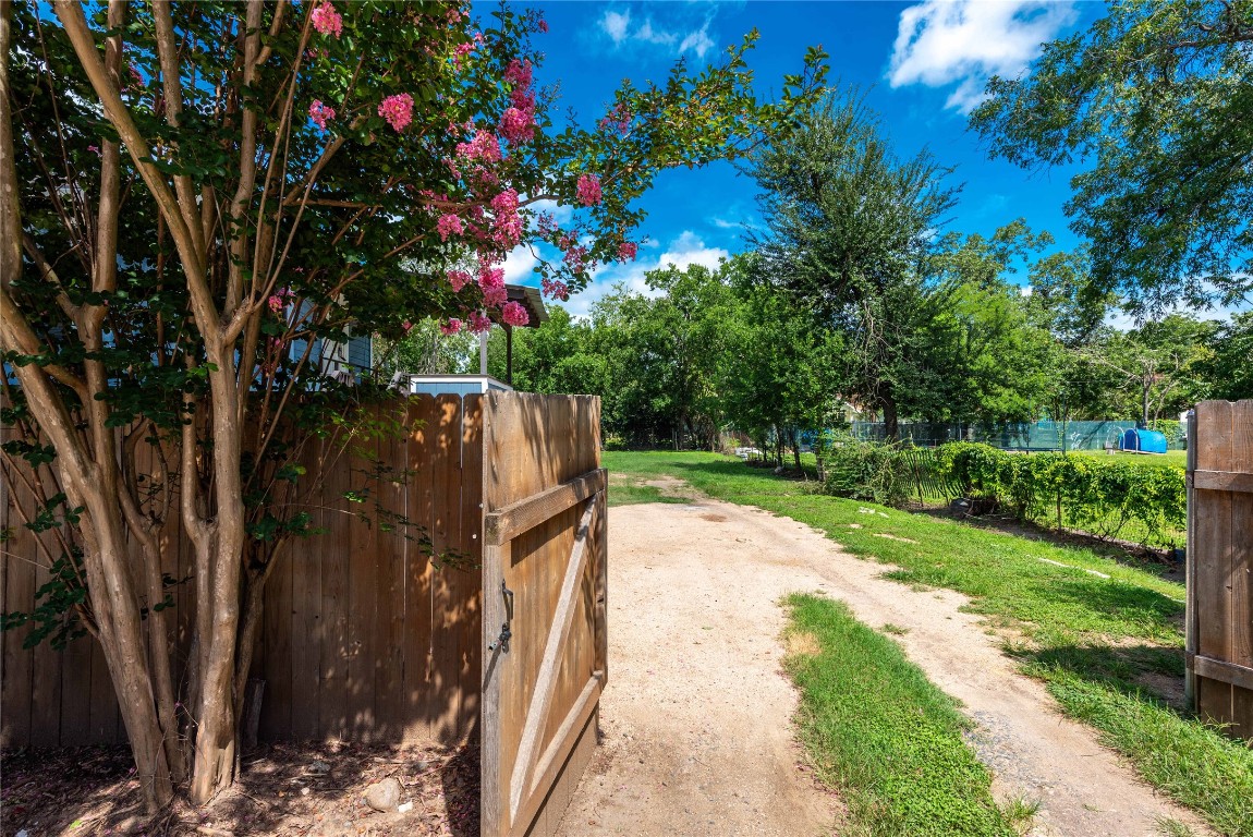 406 Lexington Road, Unit B Elgin, TX 78621 - Photo 19 of 21 a view of a backyard with pathway