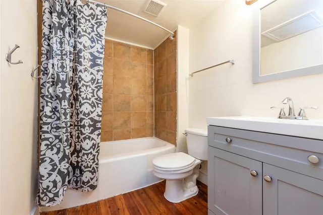 a bathroom with a toilet a sink and a bathtub