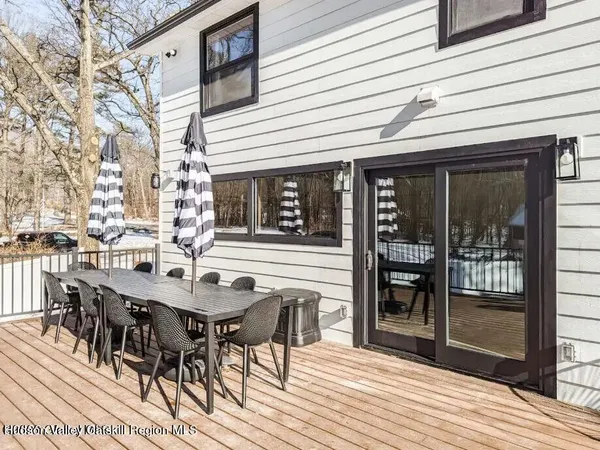 a view of a patio with table and chairs