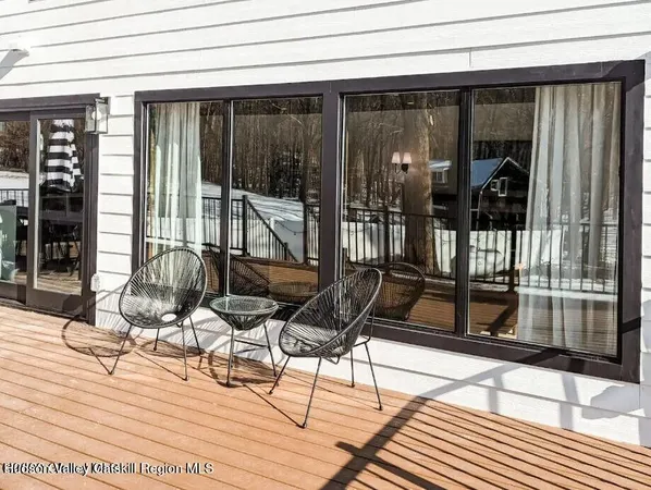 a view of backyard with a patio and glass door