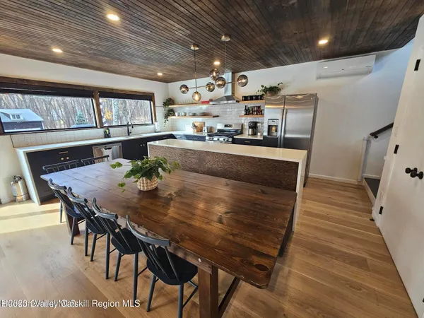 a view of a dining room with furniture window and wooden floor