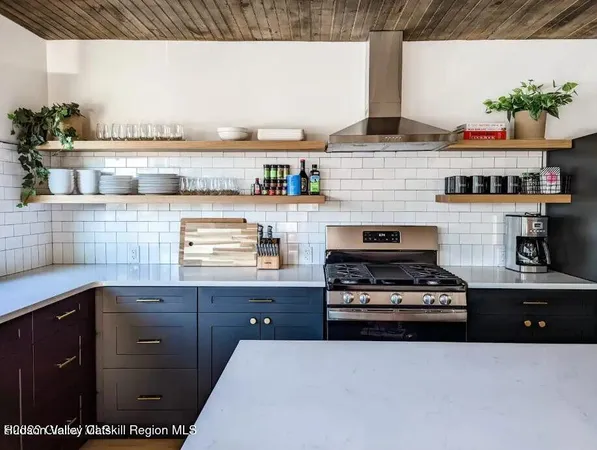 a kitchen with a stove and cabinets