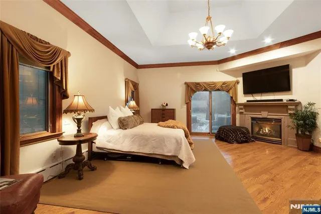 a bed room with furniture and a chandelier