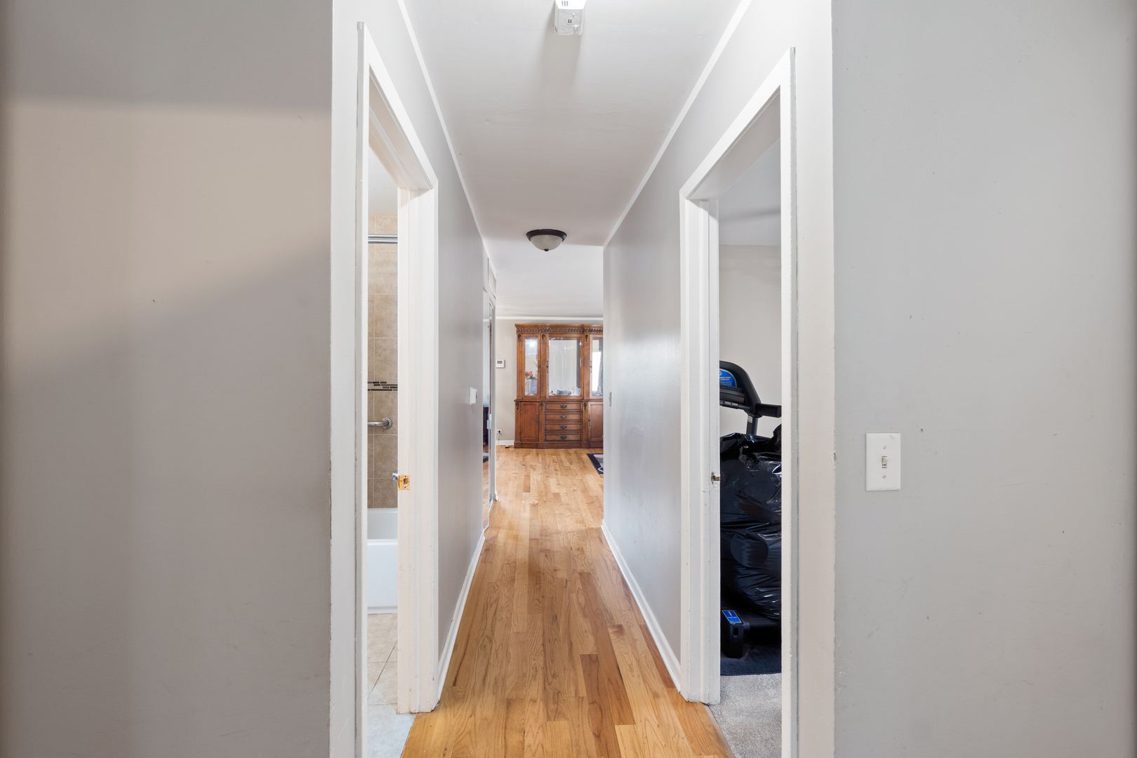111 Deerpath Road Matteson, IL 60443 - Photo 12 of 23 a view of a hallway with wooden floor and staircase