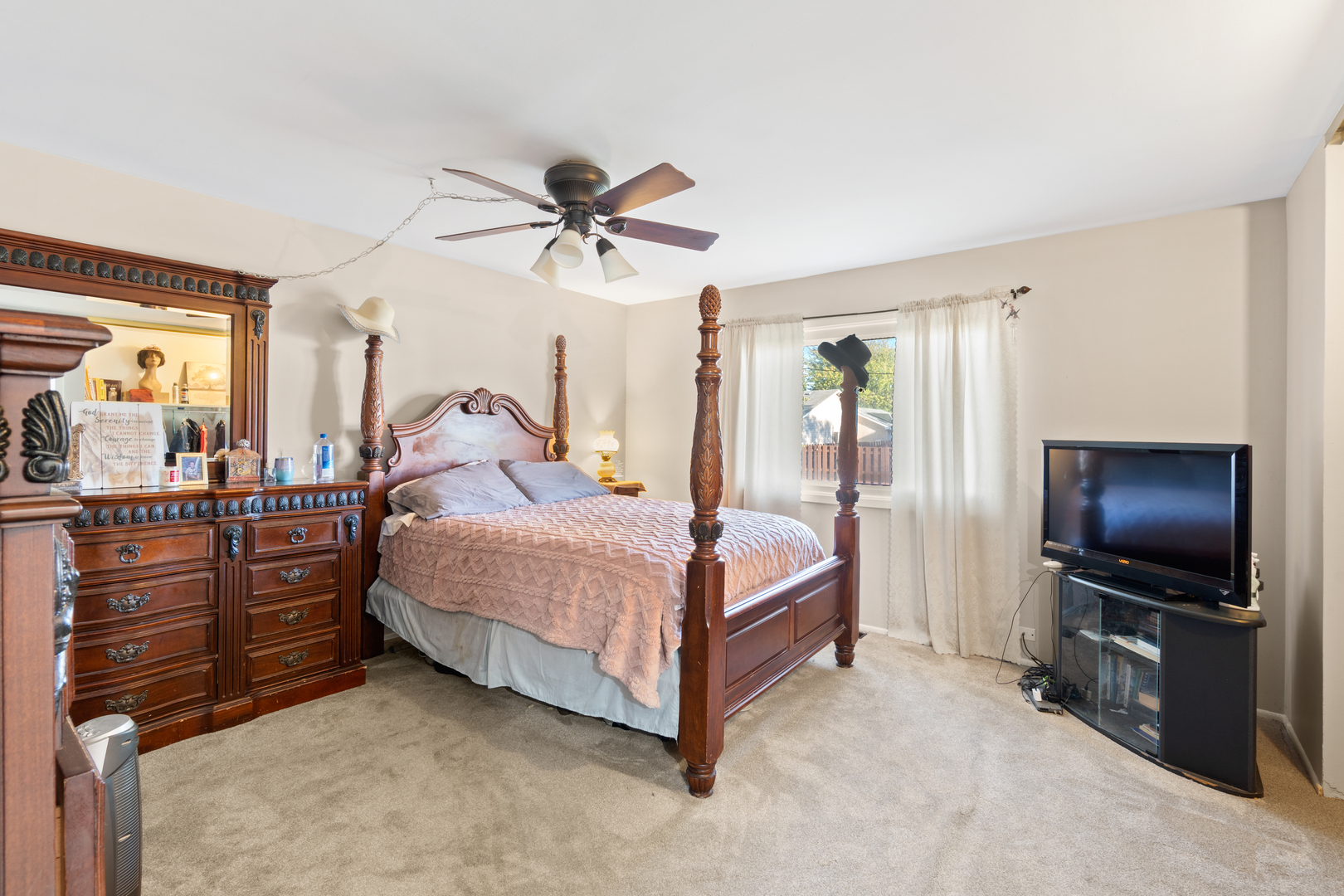 111 Deerpath Road Matteson, IL 60443 - Photo 13 of 23 a bedroom with a bed and a flat screen tv