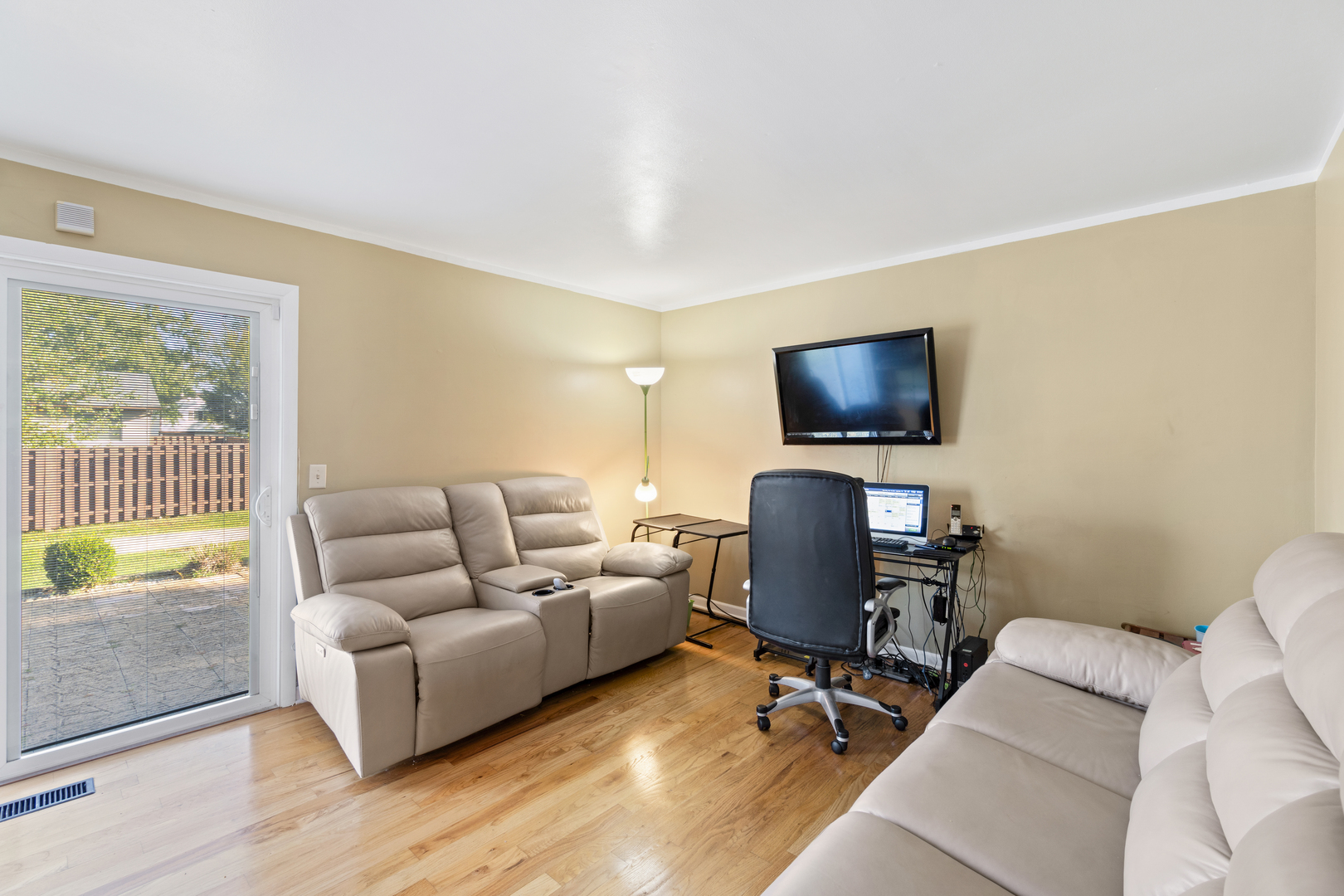 111 Deerpath Road Matteson, IL 60443 - Photo 5 of 23 a living room with furniture and a flat screen tv