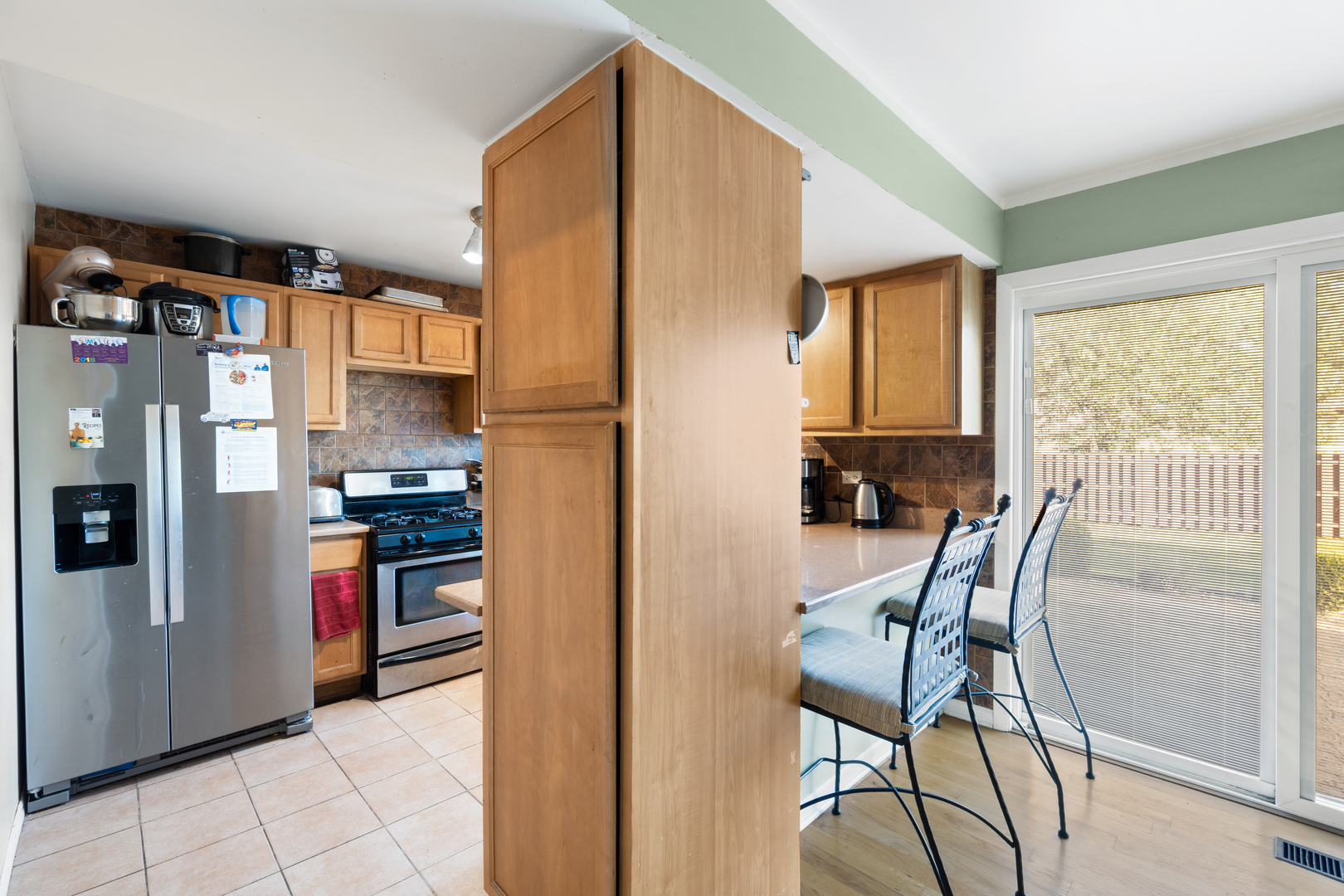 111 Deerpath Road Matteson, IL 60443 - Photo 9 of 23 a open kitchen with stainless steel appliances granite countertop a refrigerator and a stove top oven