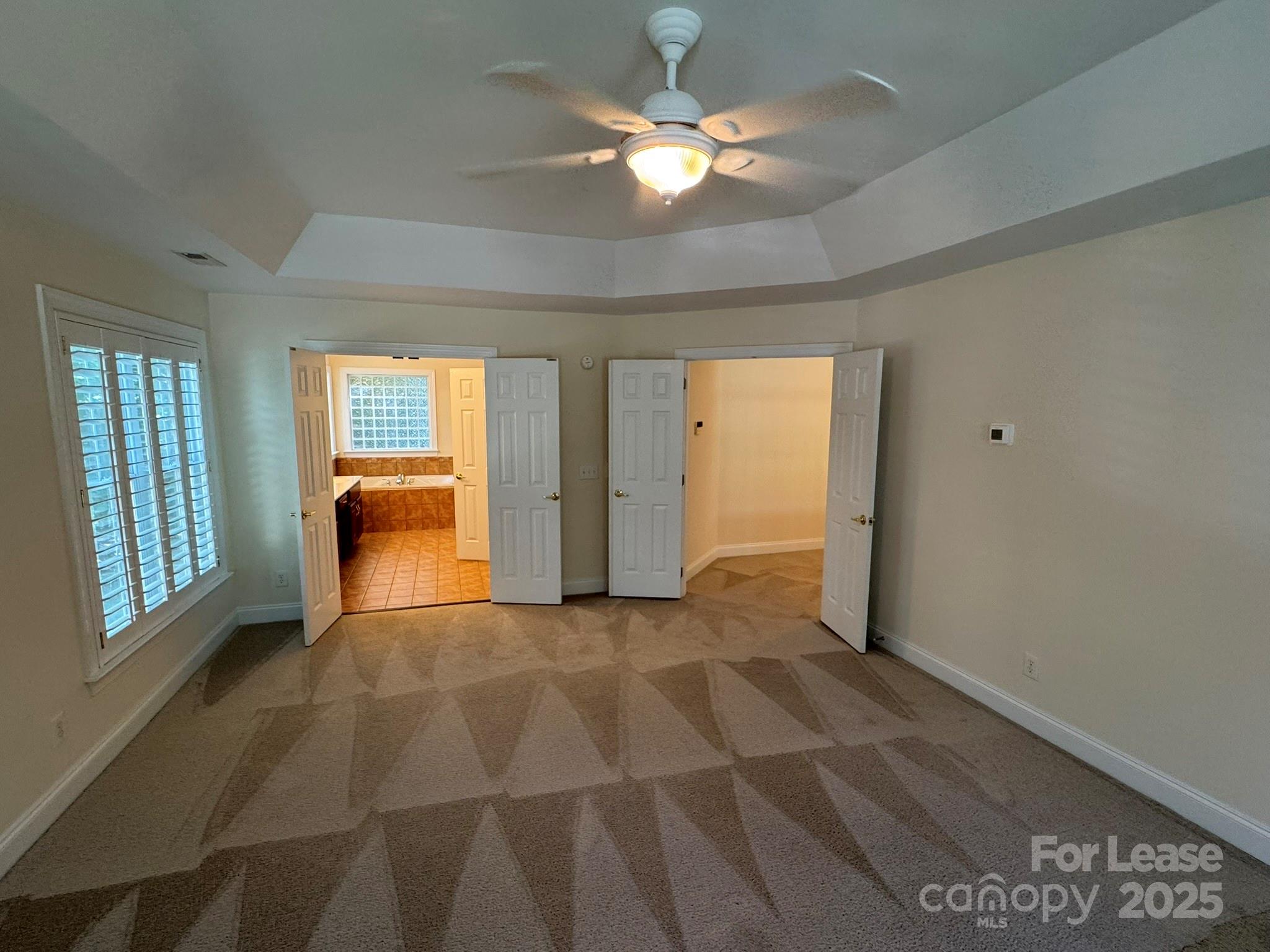 7127 Weddington Brook Drive Matthews, NC 28104 - Photo 13 of 31 a view of a livingroom with a ceiling fan & a window