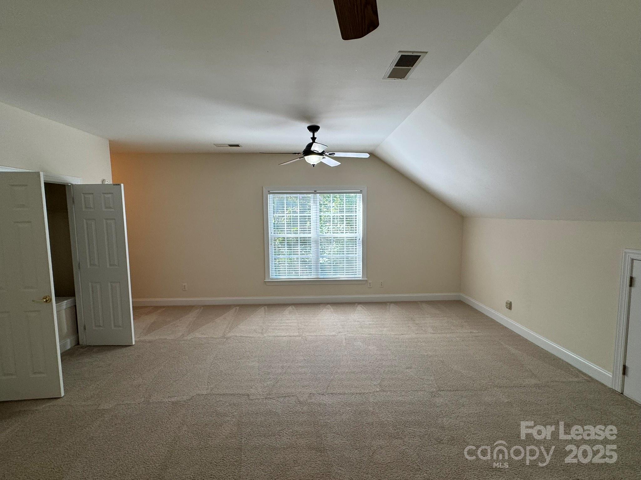 7127 Weddington Brook Drive Matthews, NC 28104 - Photo 17 of 31 an empty room with windows and ceiling fan