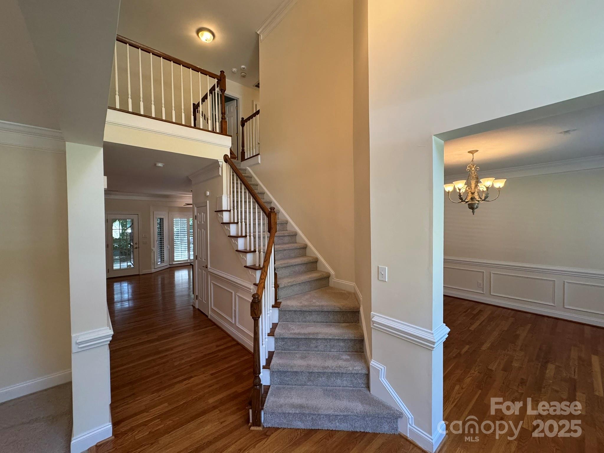 7127 Weddington Brook Drive Matthews, NC 28104 - Photo 2 of 31 a view of entryway and hall with wooden floor