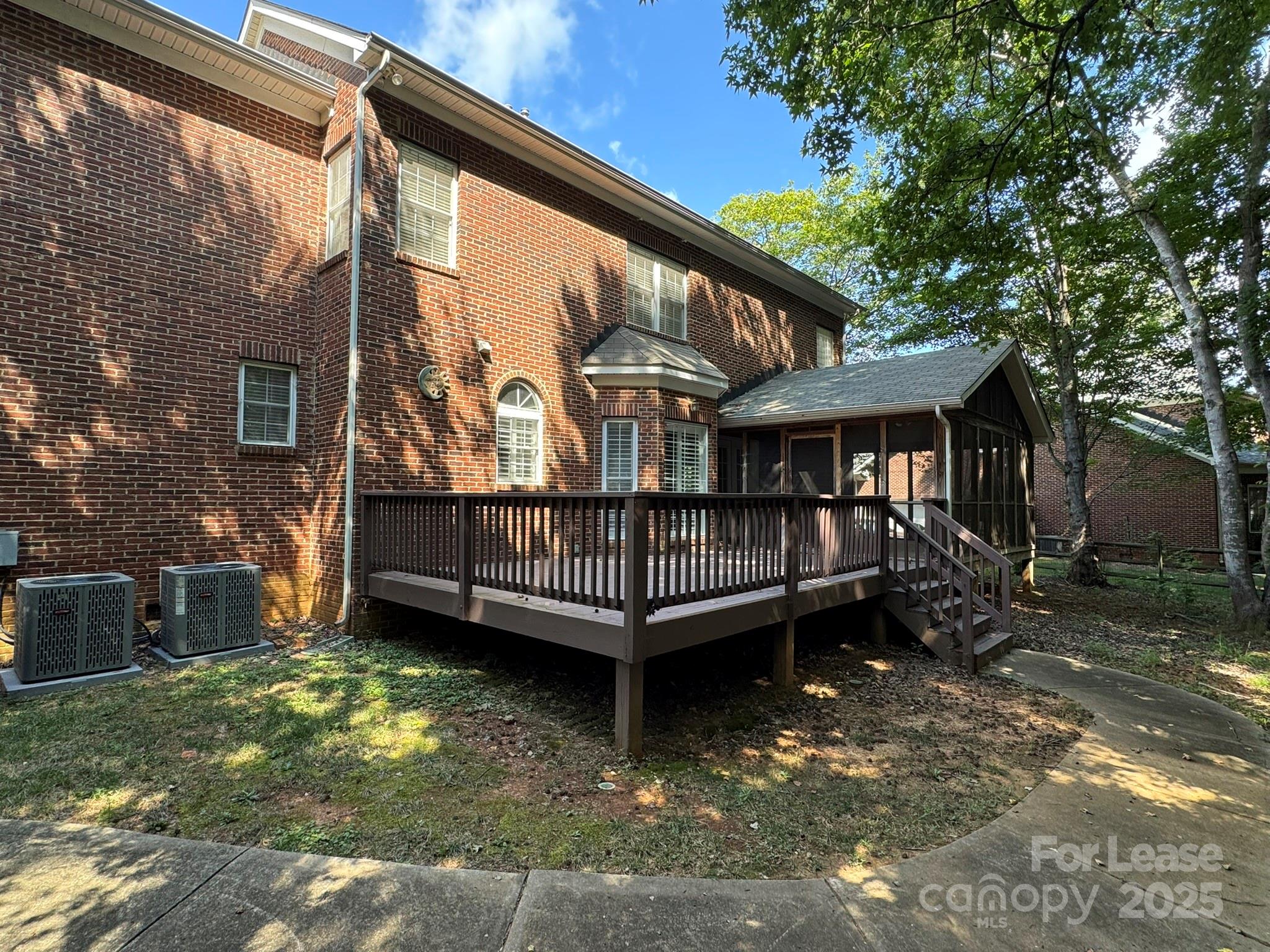7127 Weddington Brook Drive Matthews, NC 28104 - Photo 30 of 31 a view of a house with a yard and deck
