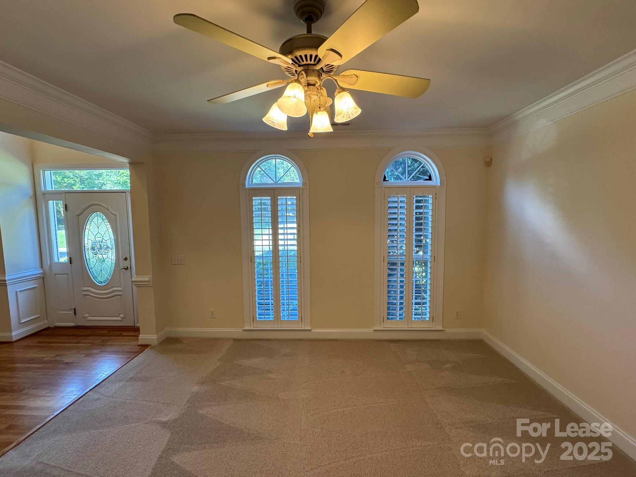 7127 Weddington Brook Drive Matthews, NC 28104 - Photo 3 of 31 an empty room with windows and fan