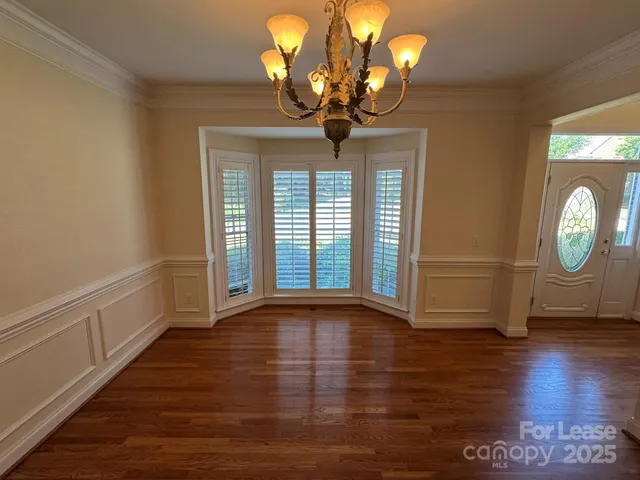 a view of livingroom with window and wooden floor
