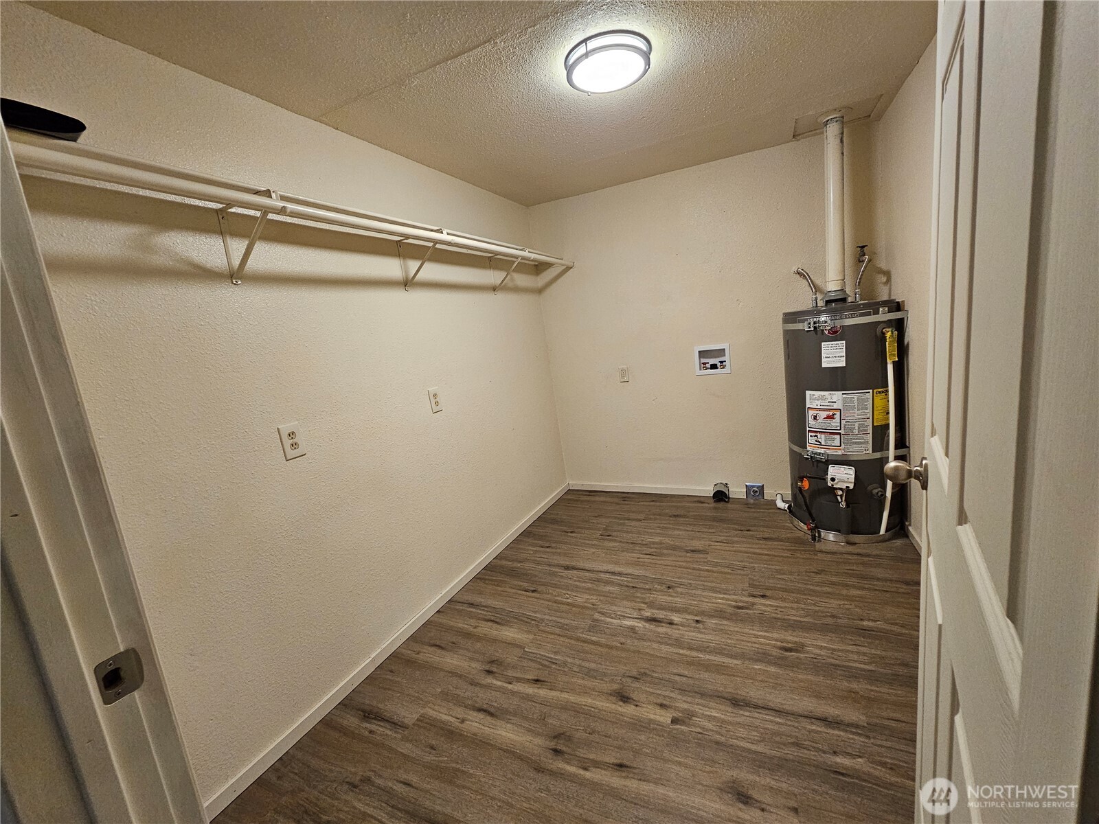 7606 Union Mills Road Southeast Lacey, WA 98503 - Photo 14 of 16 a view of a room with wooden floor