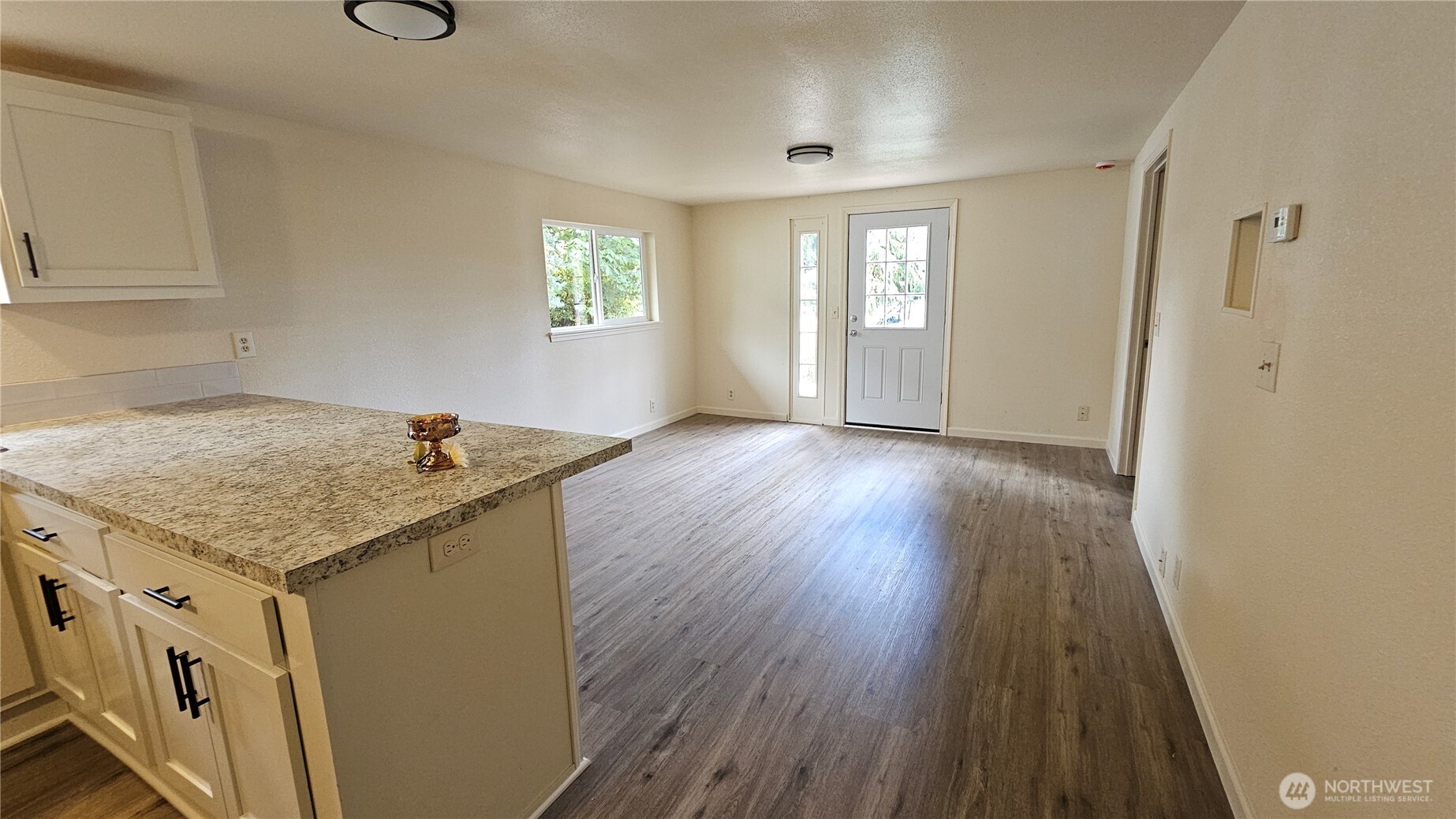 7606 Union Mills Road Southeast Lacey, WA 98503 - Photo 4 of 16 an empty room with windows